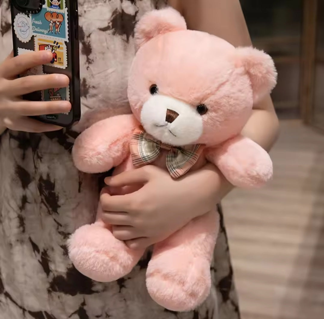 Classic teddy bear plush toy in soft brown fabric, measuring 25cm or 30cm, holding a delicate rose, designed for children aged 3 and up