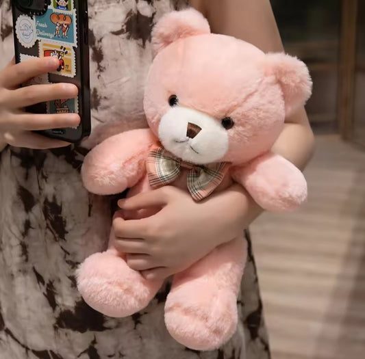 Classic teddy bear plush toy in soft brown fabric, measuring 25cm or 30cm, holding a delicate rose, designed for children aged 3 and up