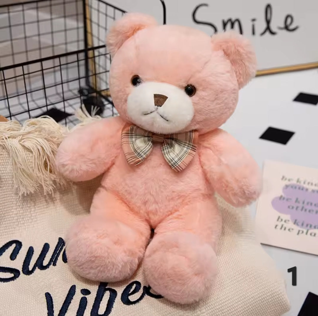 Classic teddy bear plush toy in soft brown fabric, measuring 25cm or 30cm, holding a delicate rose, designed for children aged 3 and up